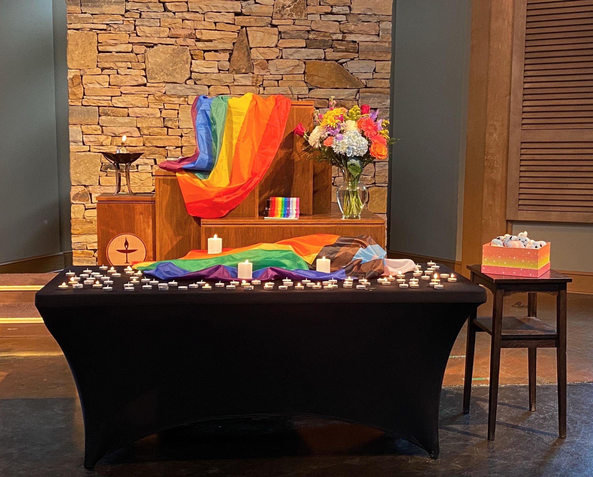 Table celebrating Pride Month at UUCB